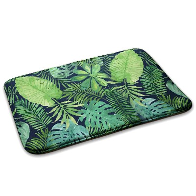 Tapete Folhas tropicais verdes sobre um fundo escuro